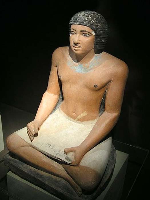 Seated statue of an Egyptian scribe found in the Western cemetery at Giza; 5th dynasty.