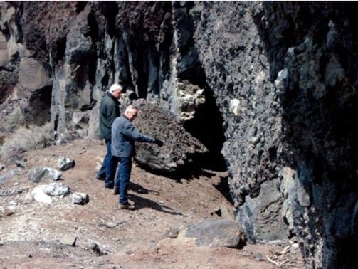 Dennis Jenkins points to an area inside one of caves