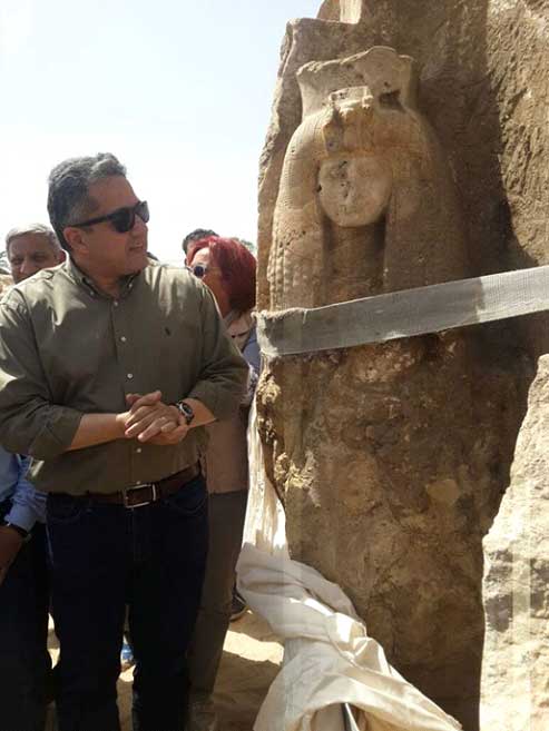 Minister of Antiquities examining the discovery of the Queen Tiye statue. Credit: Ministry of Antiquities