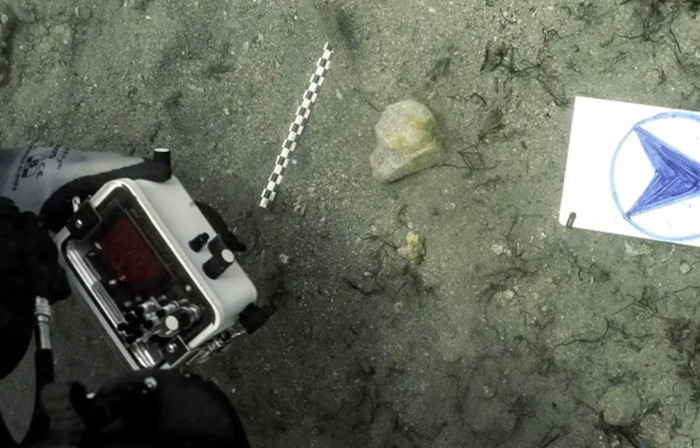 The piece of marble in situ at the find site.