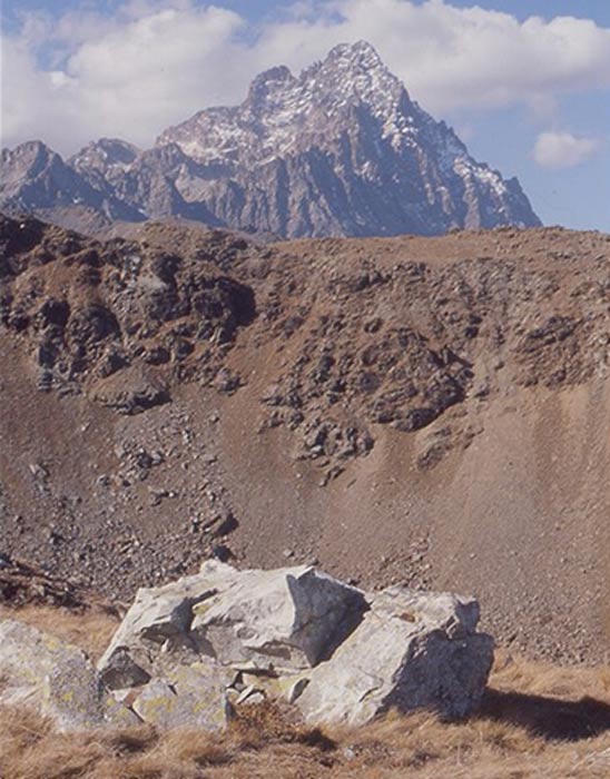 Block of raw jadeitite from the Oncino valley with Mont Viso in the background.