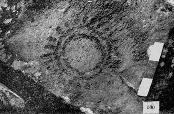 Ancient rock art paintings featuring symbols of lunar and solar events.