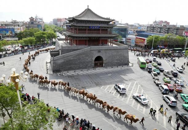 Camels and tea merchants wind through the streets of Zhangye as they retrace the ancient Silk Road route to Kazakhstan.