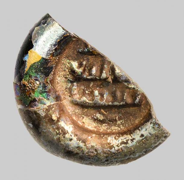 Early-Islamic glass weight of just 12 millimeters in diameter with an Arabic inscription found at Khirbat al-Minya.