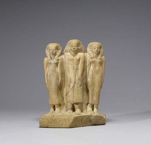 Family Group of Three. Middle Kingdom limestone. (c. 1850-1800 BC)