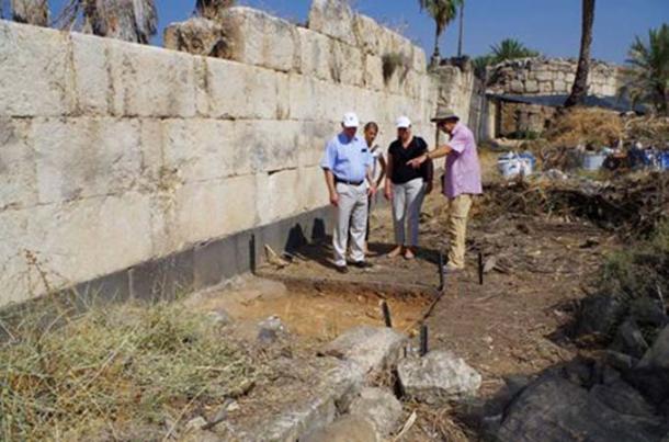 The German ambassador (left) viewing the new excavations along the eastern wall of the palace.