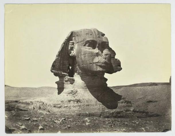 The Great Sphinx in 1867. Note its unrestored condition, still partially buried body, and man standing beneath its ear. 