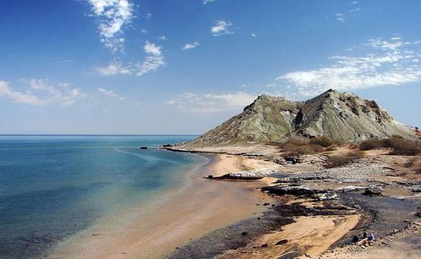 The rocks and sandy beaches of Hormuz Island, Persian Gulf, Iran.