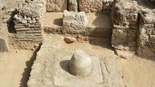 Marble omphalos (navel of the world), representing the stone Zeus threw from the heavens).
