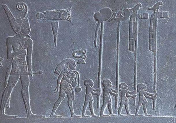 Narmer in a procession with standard bearers, falcons, on detail of the Narmer Palette.