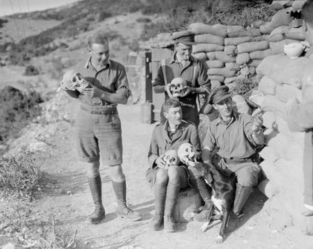 Officers of the 2nd King's Shropshire Light Infantry with skulls excavated during the construction of trenches and dugouts at the ancient Greek site of Amphipolis, 1916.