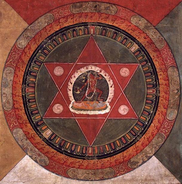 Painted 19th century Tibetan mandala of the Naropa tradition, Vajrayogini stands in the center of two crossed red triangles, Rubin Museum of Art.