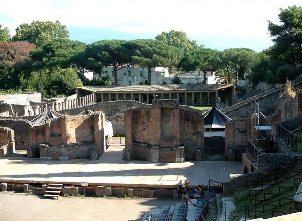Pompeii was a flourishing city entombed in volcanic ash. Many people are believed to have escaped the eruption of Mount Vesuvius, but some people and many buildings, including this grand theater, were preserved in ash.