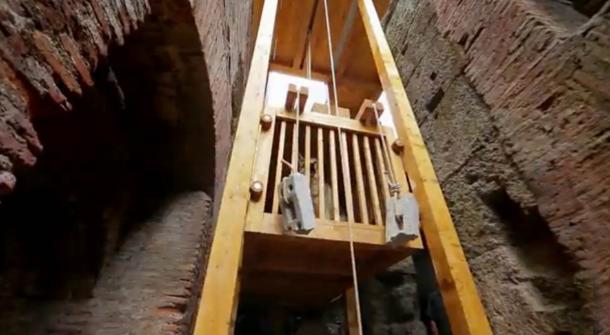 Reconstructed elevator once used to raise wild animals into the arena of the Colosseum. Screenshot from ‘Colosseum: Roman Death Trap – Releasing the Wolf’.
