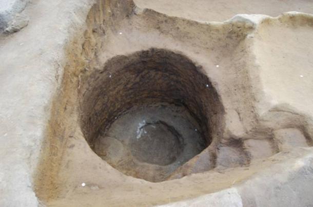The circular well accessed by a staircase.