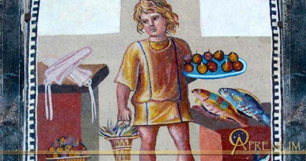 A boy holding a platter of fruits with a bucket of crabs, in a kitchen with fish and squid, on the June panel from a mosaic depicting the months (3rd century)