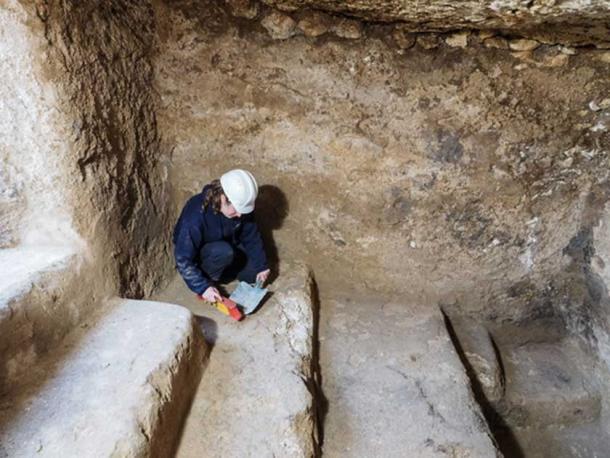 An archaeologist collects material in an underground chamber that may have been a hideout for rebels during the Bar Kokhba Revolt of the 2nd century AD. 