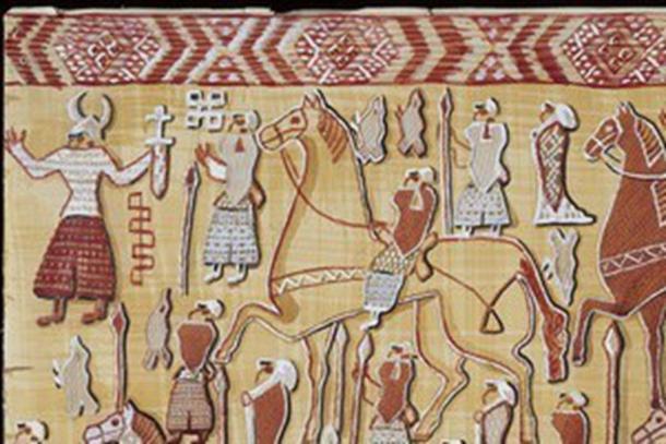 Section of tapestry discovered in the Oseberg ship burial mound showing a figure wearing a horned helmet.