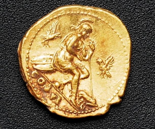 One of the gold coins discovered among the bodies.
