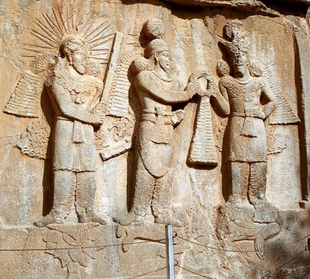 Mithra (left) in a 4th-century investiture sculpture at Taq-e Bostan in western Iran.