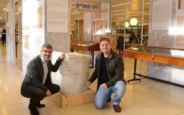 Dr. Gil Gambash, left, and Dr. Assaf Yasur-Landau with the large stone inscription.