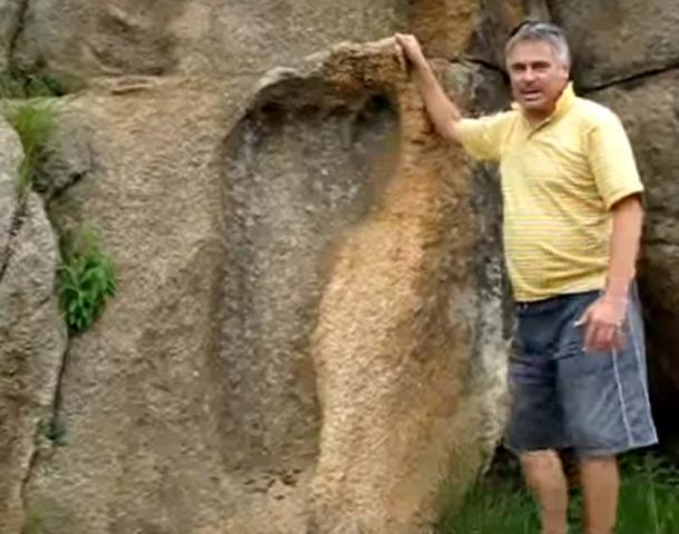 Michael Tellinger with the massive footprint in the rock in Africa 