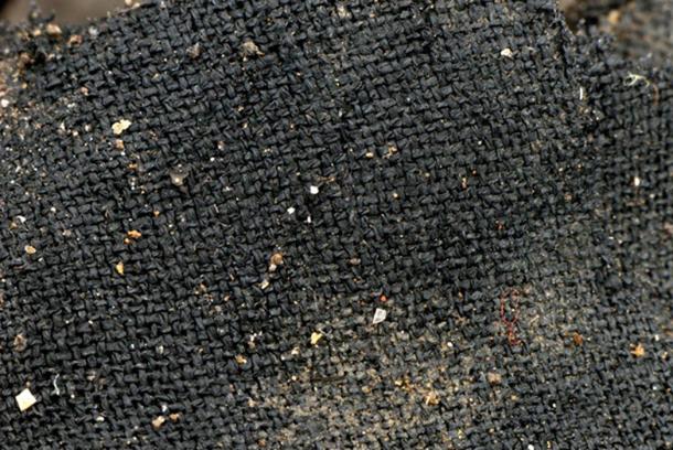 This photo may not look like much, but it is a fantastically preserved specimen of a 3,000-year-old textile piece from the Must Farm site. An expert says some of the textiles at the site are as fine as any of Europe at that time.