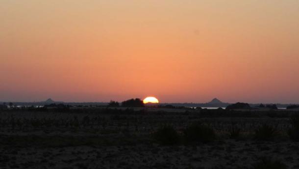 The sun rises right behind the Aghurmi mound on the spring equinox.