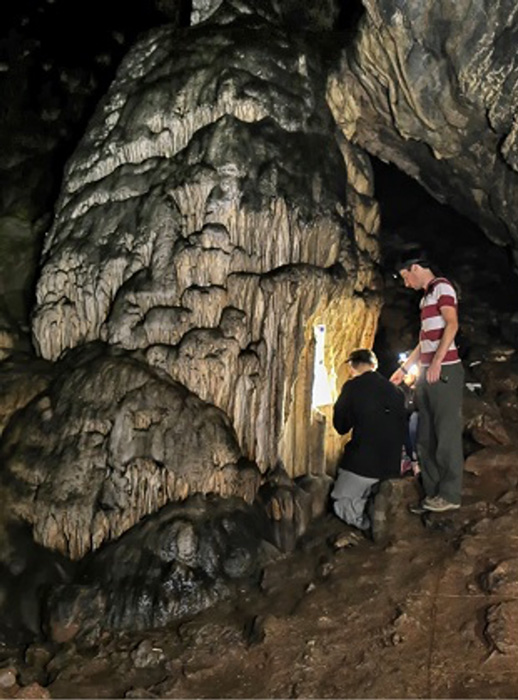 Researchers in the Ardales Cave in Malaga Spain where the Neanderthal painting of a section of stalagmites was discovered and thoroughly analyzed. (University of Barcelona)
