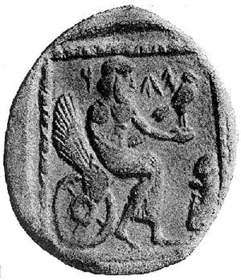 A 4th century BCE drachm (quarter shekel) coin from the Persian province of Yehud Medinata, possibly representing Yahweh seated on a winged and wheeled throne. An inscription lies on the face of the coin, either a Phoenician inscription on the coin reading "YHW" or an Aramaic inscription reading "YHD"