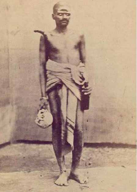 An Aghori carrying a skull and alcohol circa 1875. (Public domain)