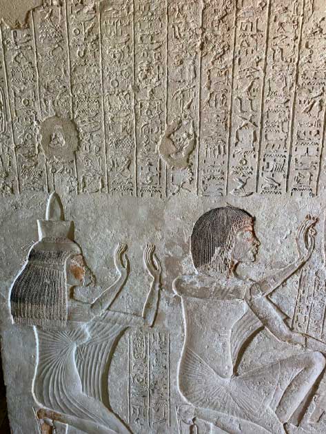 A depiction of Aye and his wife Tey, above which is inscribed the famous Hymn to the Aten. Tomb of Aye, #25, Amarna, Egypt. In this ground-breaking hymn, written by Akhenaten, the Aten assumes the role previously held in Egyptian myth by Osiris: “You (Aten) who rise and make all creation grow for the king … You (Aten) make the inundation from the underworld … as for all distant countries, you make their life… how functional are your plans, O Lord of Continuity!” (a title formerly held by Osiris). (© Jonathon A. Perrin)