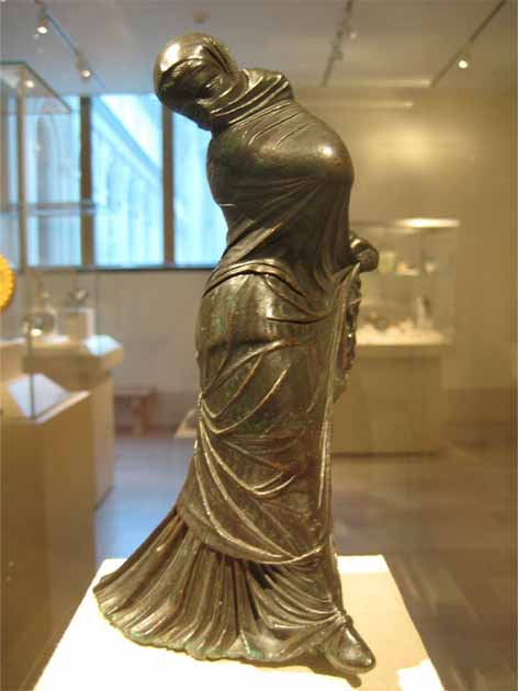 Bronze statuette of a veiled and masked dancer. Greek, 2nd–3rd century BC (Claire H / CC BY SA 3.0)