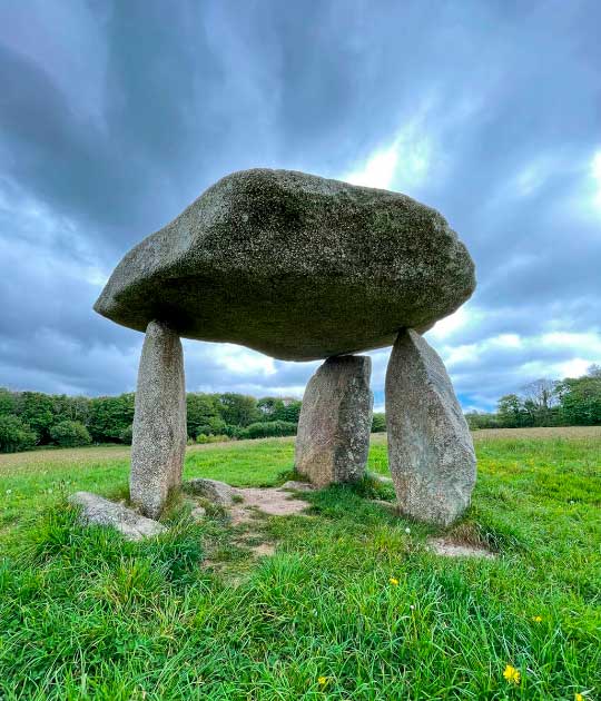 Carwynnen Quoit, Cornwall. The Carwynnen Quoit is an ancient dolmen which once sat in a field a few miles from the town of Camborne in Cornwall, in Southwest England.  The 5,000-year-old structure collapsed in 1967 but the ancient monument has been restored to its former glory. (Sacredsites.com)