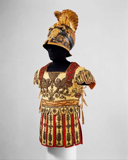 Costume Armor in the Classical Style ca. 1788–90 AD. The helmet includes an original paper label of Hallé French. The embroidered tunic represents an embossed bronze cuirass of the type worn by high-ranking Roman officers. Source: The Metropolitan Museum of Art, Public Domain.