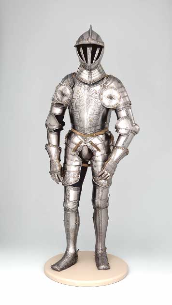 Armor of Emperor Ferdinand I, dated 1549 AD. The ownership of this armor by Ferdinand I (1503–1564) is indicated by heraldic emblems on the toe caps: the imperial double-headed eagle surmounted by a royal crown. Weight: 52 lb. 14 oz. (24 kg). Source: The Metropolitan Museum of Art, Public Domain.