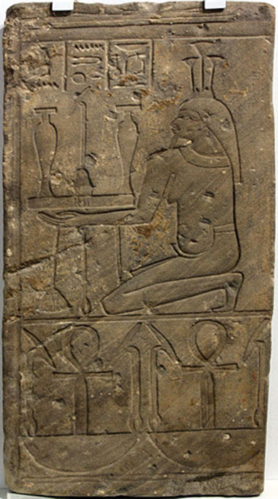 Fragment of a temple relief with Nile god Hapi. The inscription on the fieze reads 