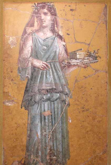 Fresco of woman wearing a head covering and holding a tray, from the Villa San Marco, Stabiae, 1st century AD (Public Domain)