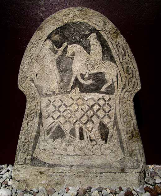 Picture stone from Gotland, Sweden (8th to 9th centuries) showing a woman offering a drink to a Viking. (Public domain)