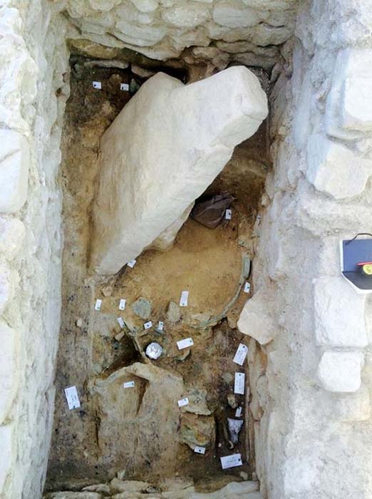Looking inside the Griffin Warrior tomb.