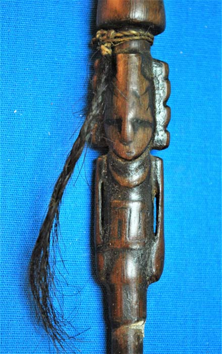 Intricately carved figure on a delicate snuffing tube. (José Capriles et al, Penn State)