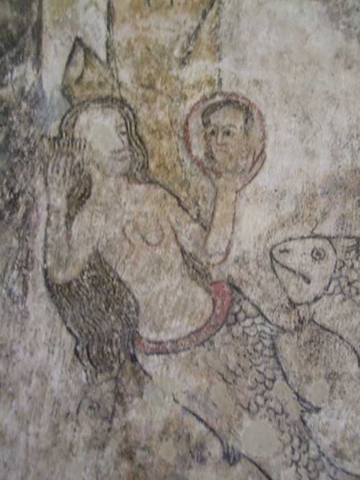 Late medieval mermaid shown in a wall painting at St Botolph’s church, Slapton, Northamptonshire (Image: Courtesy John Vigar)