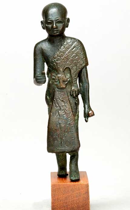 Leaded bronze statuette of a sem priest wearing a leopard-skin cloak with an image of the god of the Underworld, Osiris, on his skirt. Third Intermediate Period or later. Metropolitan Museum of Art, New York. (CCO 1.0)
