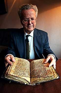 Martin Schøyen sits with the Gospel of Christ's own language from the 6th century. 