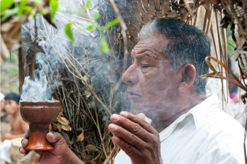 Maya Village Daykeeper Burning Copal Incense, by Ann Wuytts.