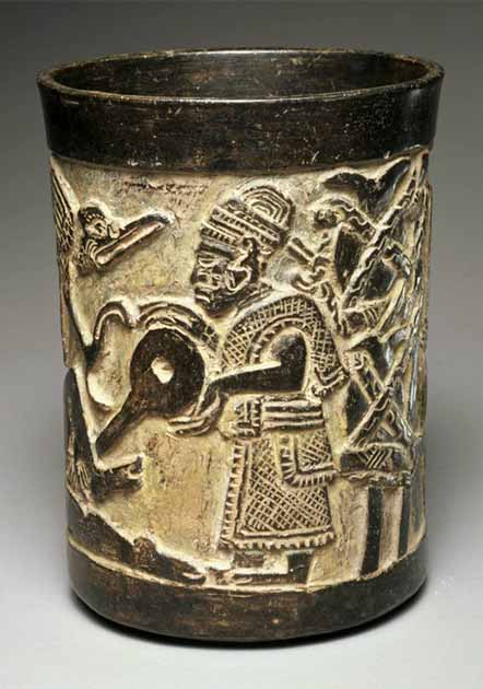 On this Maya enema beaker, a male priest is administering a drug enema to a recipient just out of the frame on the left side of this circular vessel in the collection of the Princeton University Art Museum. (Princeton University Art Museum)