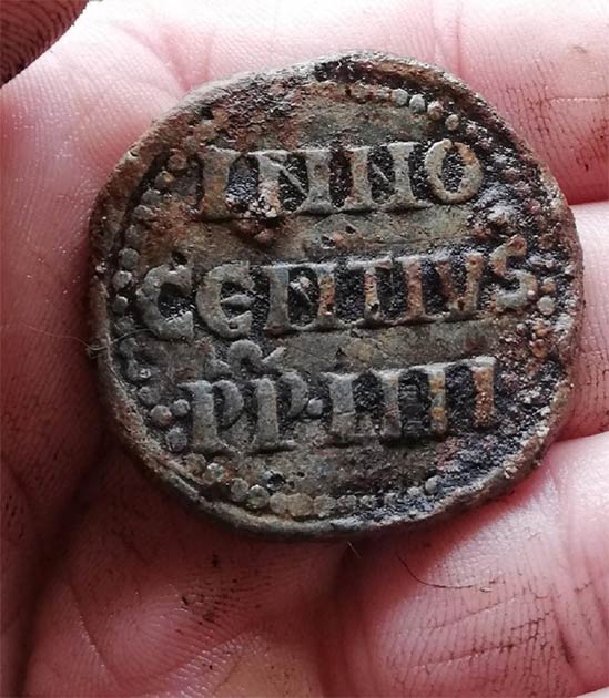 The Papal bulla (Pope’s seal) held by the man who found it. (Andy Bassett)