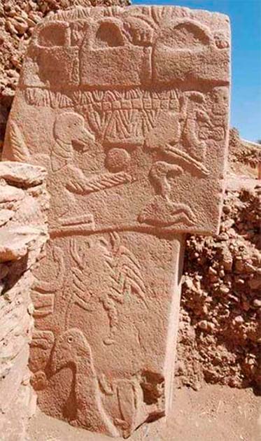 Pillar 43 from Gobekli Tepe in Turkey shows three ‘handbag’ carvings along the top. (Alistair Coombs)