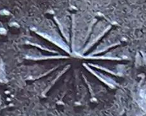 Sixteen point star. Detail, Sumerian cylinder seal.