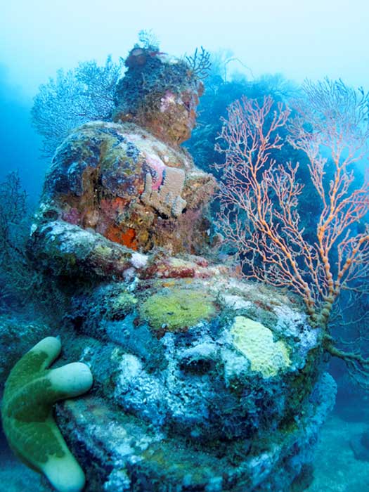Statue of lord Buddha photographed during a dive at the Temple, near Pemuteran, Bali